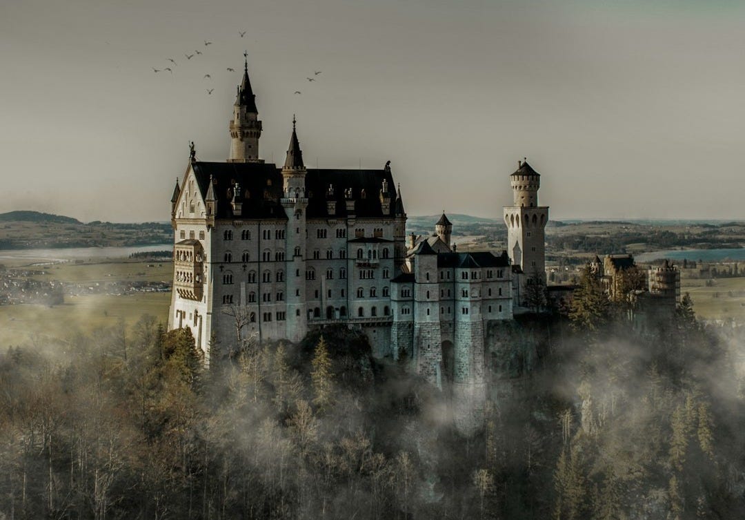 grayscale photography of white castle during daytime