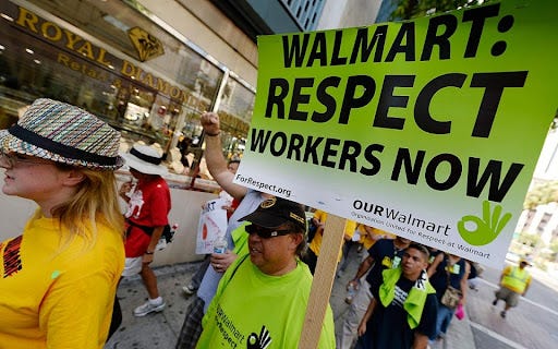Walmart workers rally in 15 US cities, demand better pay | Al Jazeera  America
