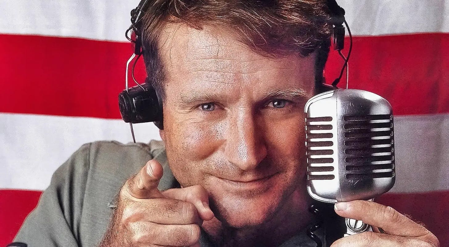Robin Williams with a microphone in Good Morning Vietnam