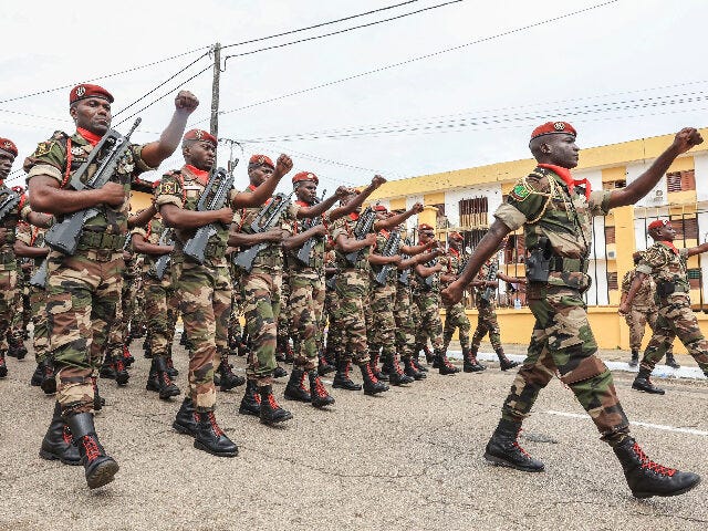 Members of the military take part in the military parade in honour of General Brice Oligui Nguema (unseen) who was inaugurated as Gabon's interim President, in Libreville on September 4, 2023. Gabon's coup leader vowed after being sworn in as interim president on September 4, 2023 to restore civilian rule …