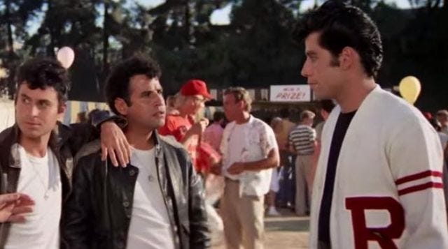 The teddy / the white jacket of Danny Zuco (with autograph John Travolta)  in Grease | Spotern
