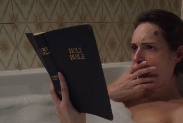 This may contain: a woman laying in a bathtub holding a bible