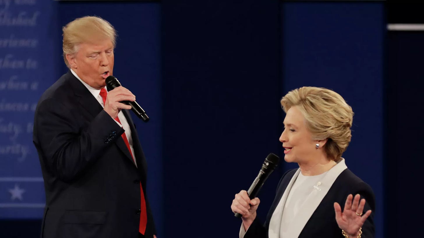 In this Oct. 9, 2016, file photo Republican presidential nominee Donald Trump and Democratic presidential nominee Hillary Clinton speak during the second presidential debate at Washington University in St. Louis. - Sputnik International, 1920, 20.07.2024