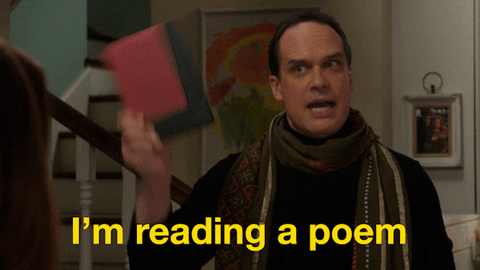 A man holds up a book and says I'm reading a poem A man holds up a book and says I'm reading a poem