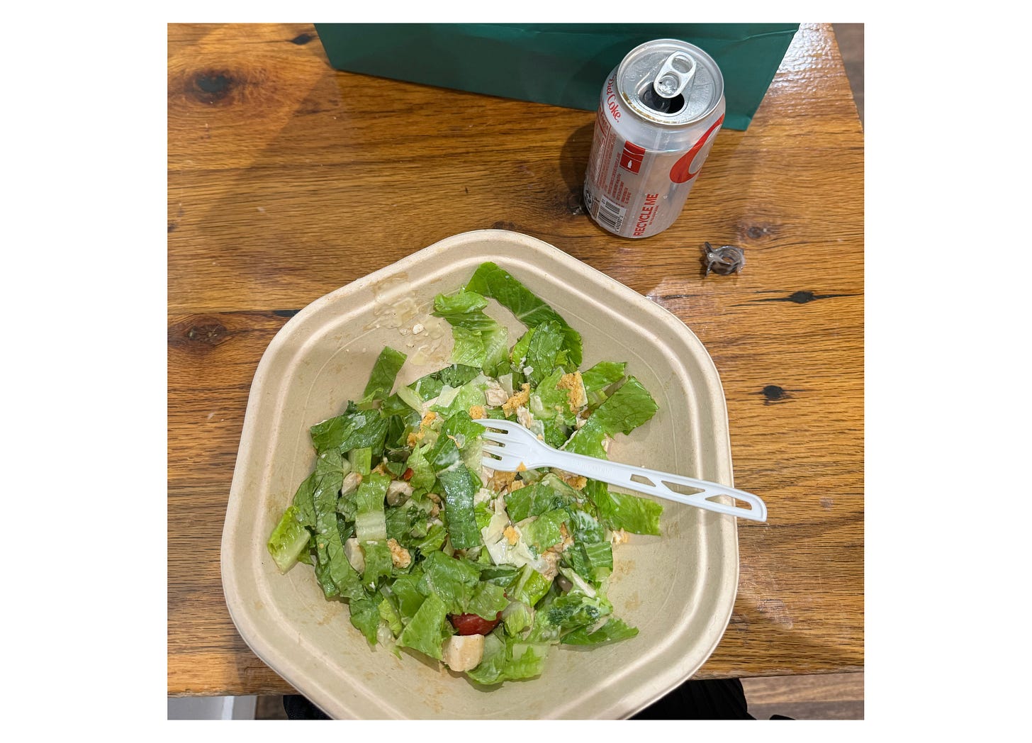 Photo of a sweetgreen salad and a Diet Coke