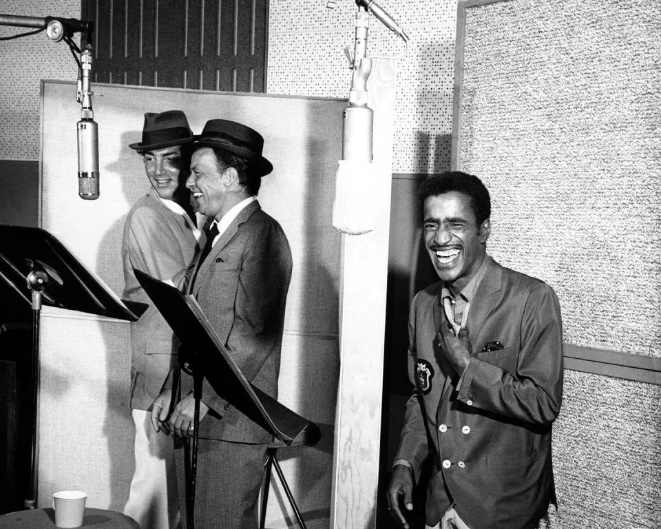 <p>The Rat Pack members seen laughing in the recording studio in 1962. </p>