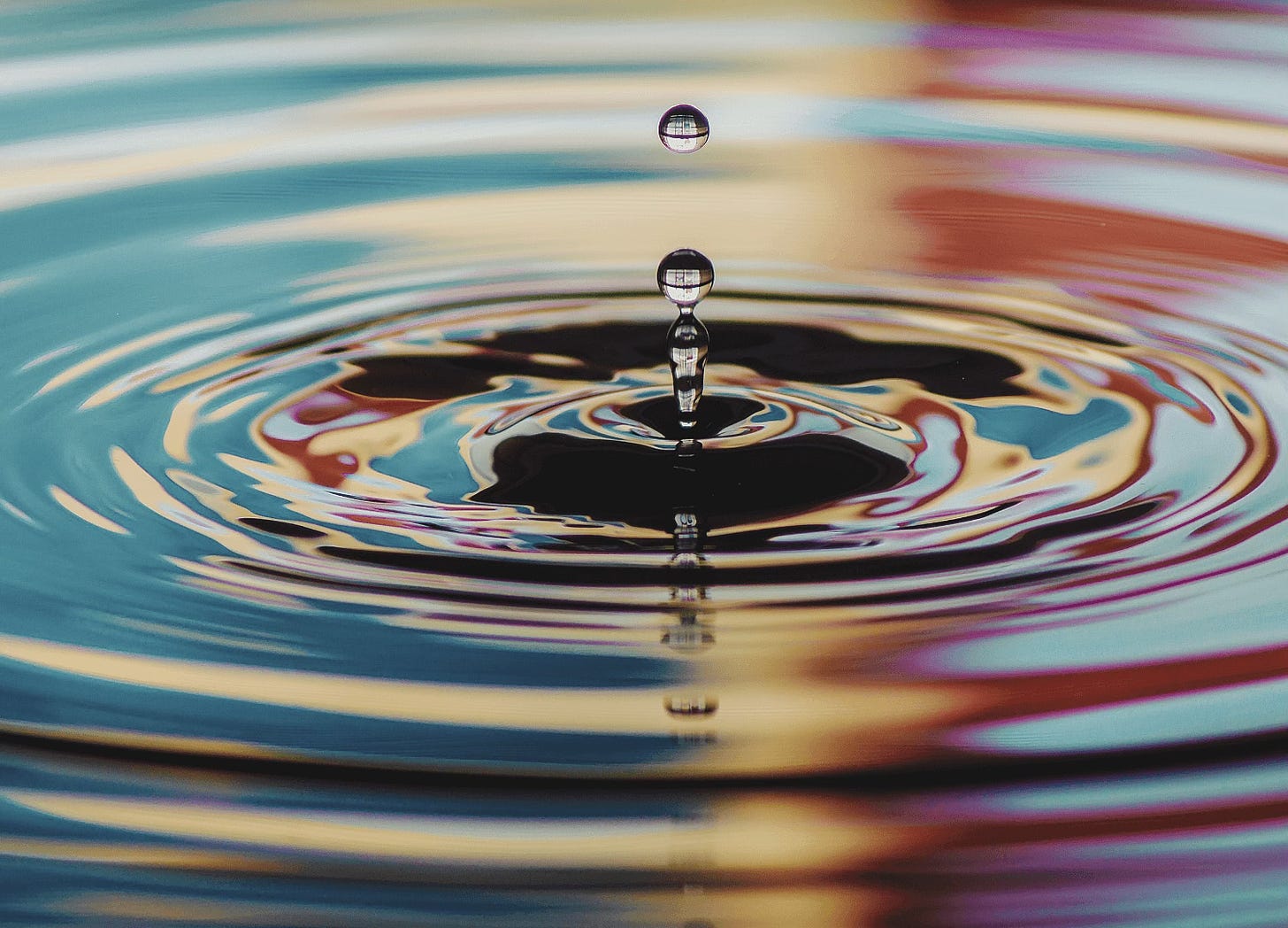 Water droplets creating ripples