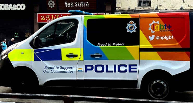 A police van parked on the street

Description automatically generated