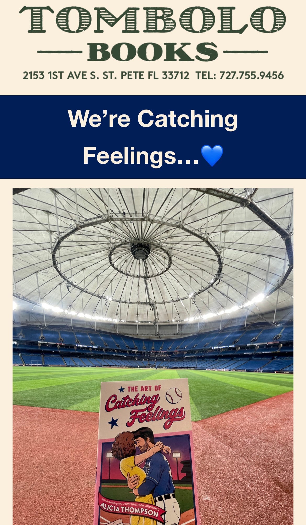 Graphic from Tombolo's newsletter about the event that says Tombolo Books, 2153 1st Ave S. St. Pete FL 33712, Tel: 727.755.9456, and then "We're Catching Feelings!" with a photo of THE ART OF CATCHING FEELINGS being held up in front of an empty Tropicana Field.