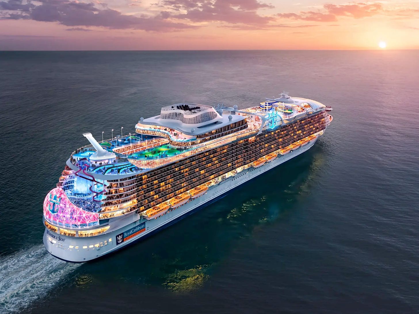 A massive Royal Caribbean cruise ship heading into the sunset