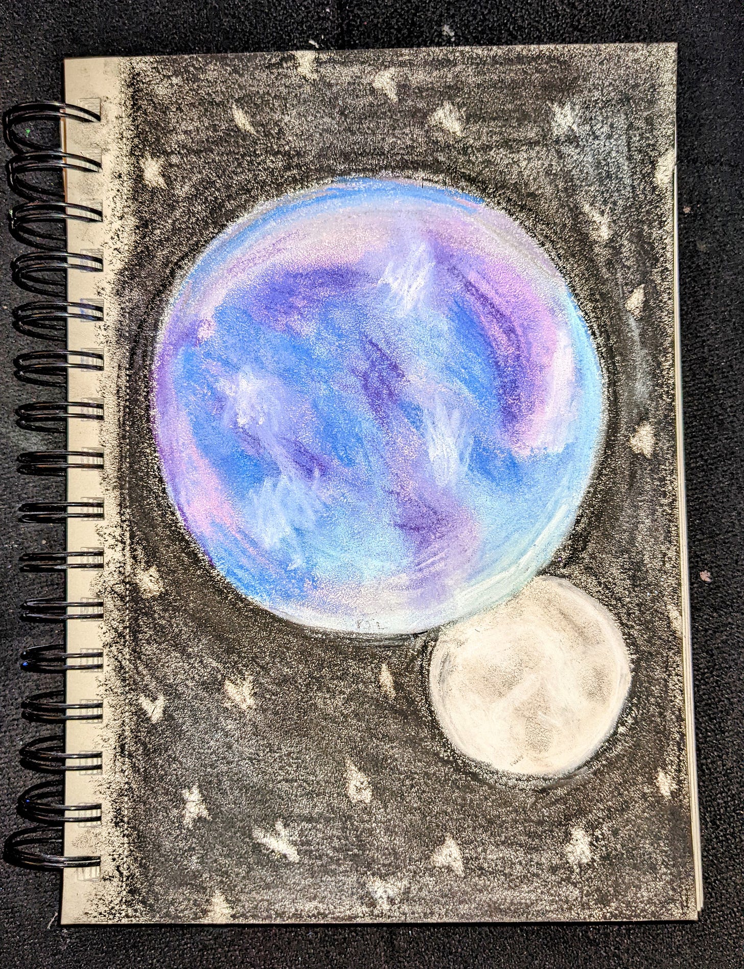pastel drawing of a planet and moon on a starry sky. Drawn by Patricia JL