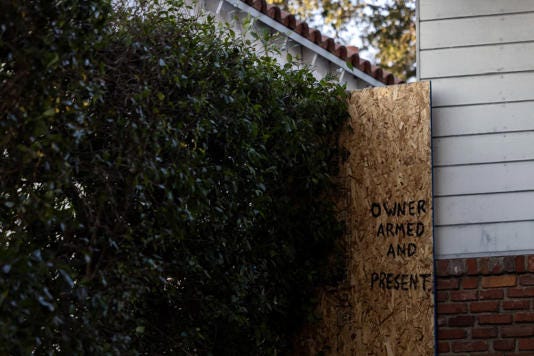 A sign posted outside a home Saturday in Altadena, Calif.