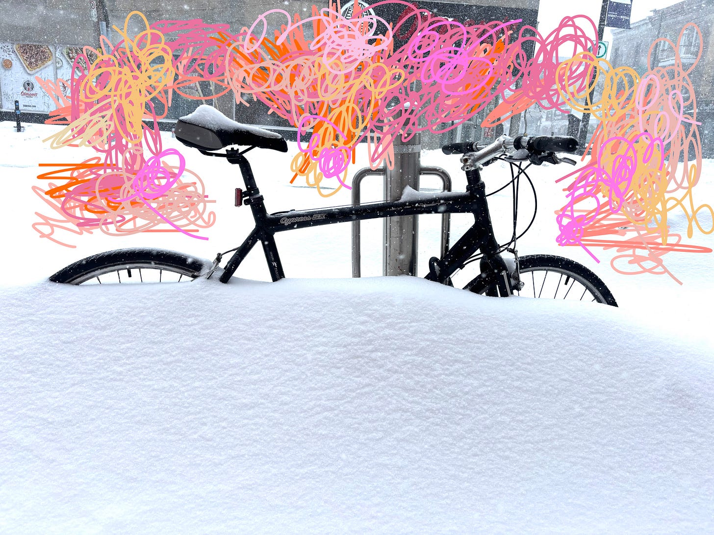 bike covered in snow in Montreal with scribble above