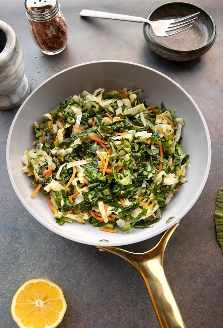 Collard greens with cabbage in skillet