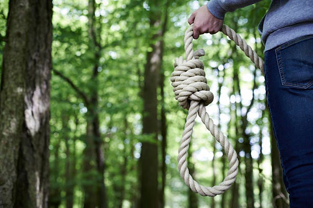 Depressed Man Contemplating Suicide By Hanging In Forest Stock Photo -  Download Image Now - iStock