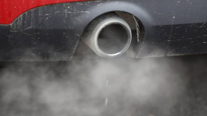 An exhaust emits fumes as a car is driven through Richmond in London, Britain December 2, 2016. REUTERS/Peter Nicholls
