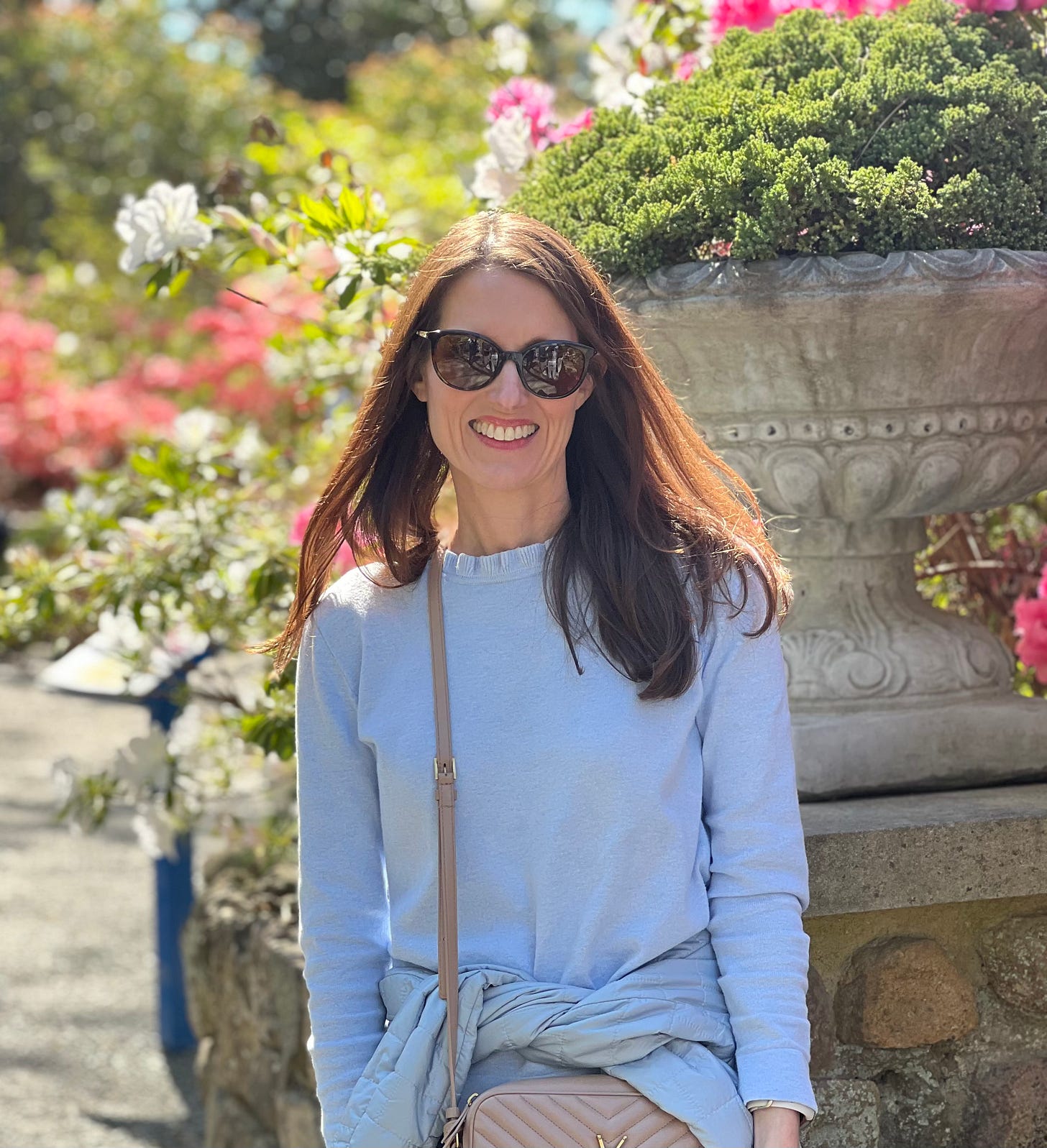 Laura at the entrance to the botanical gardens