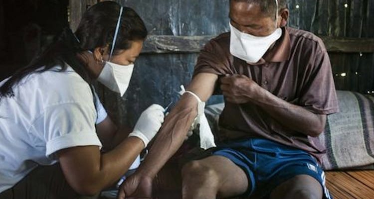 Local staff nurse draws blood from MDRTB patient Seikholien, 45, for laboratory testing. Churchandpur, Manipur, India - 24, October 2012. Credit: MSF