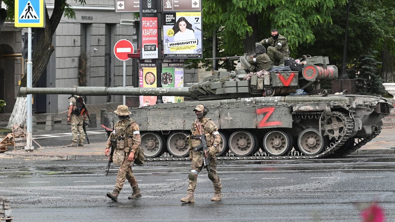 Wagner fighters deployed in a street near the headquarters of the Southern Military District in Rostov-on-Don, on June 24.