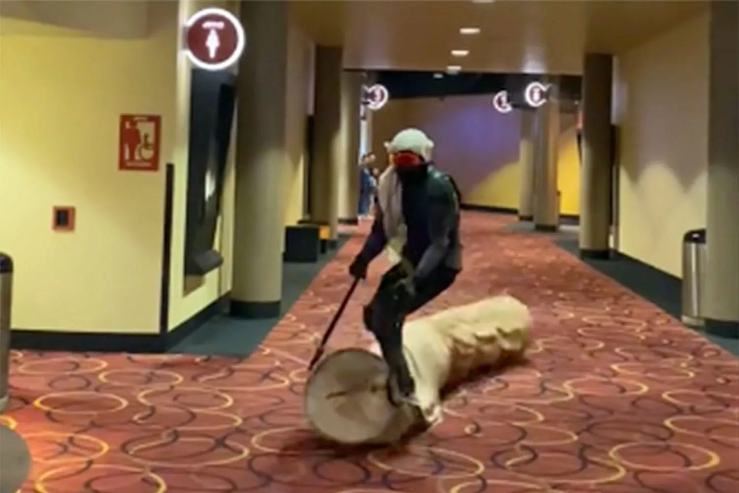 Moviegoer rides homemade sandworm to Dune screening.
