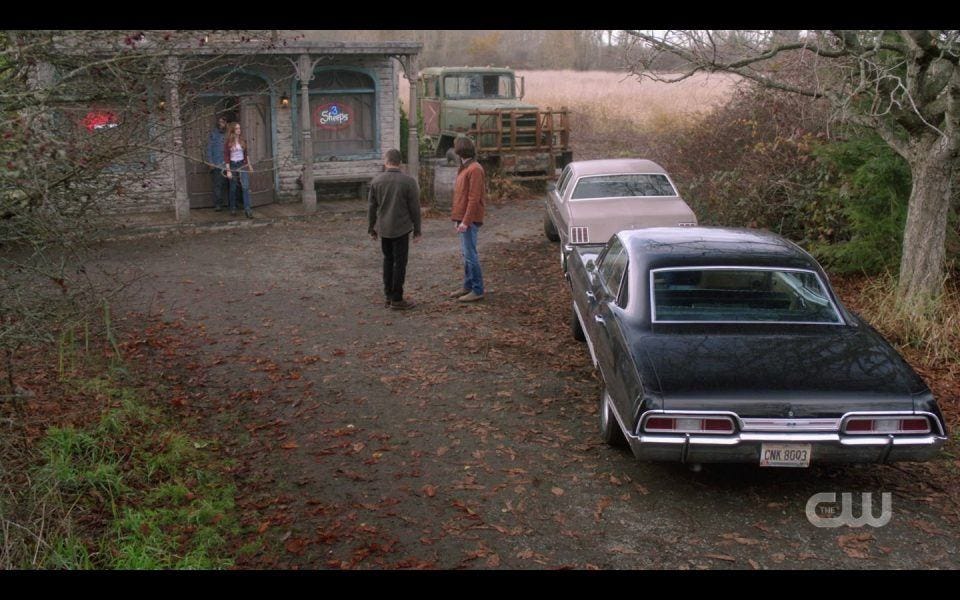 Winchester Brothers outside of pool hall with Impala Baby