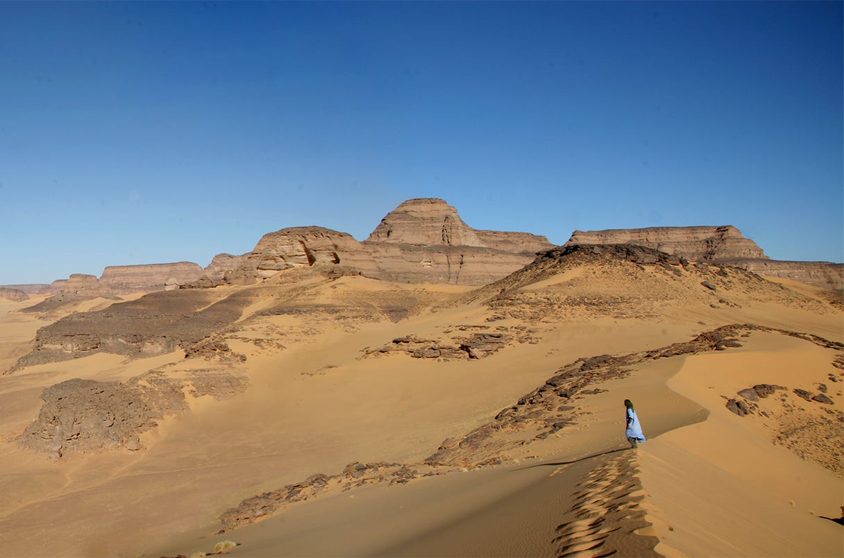 arid desert view from the Takarkori rock shelter in Libya arid desert view from the Takarkori rock shelter in Libya