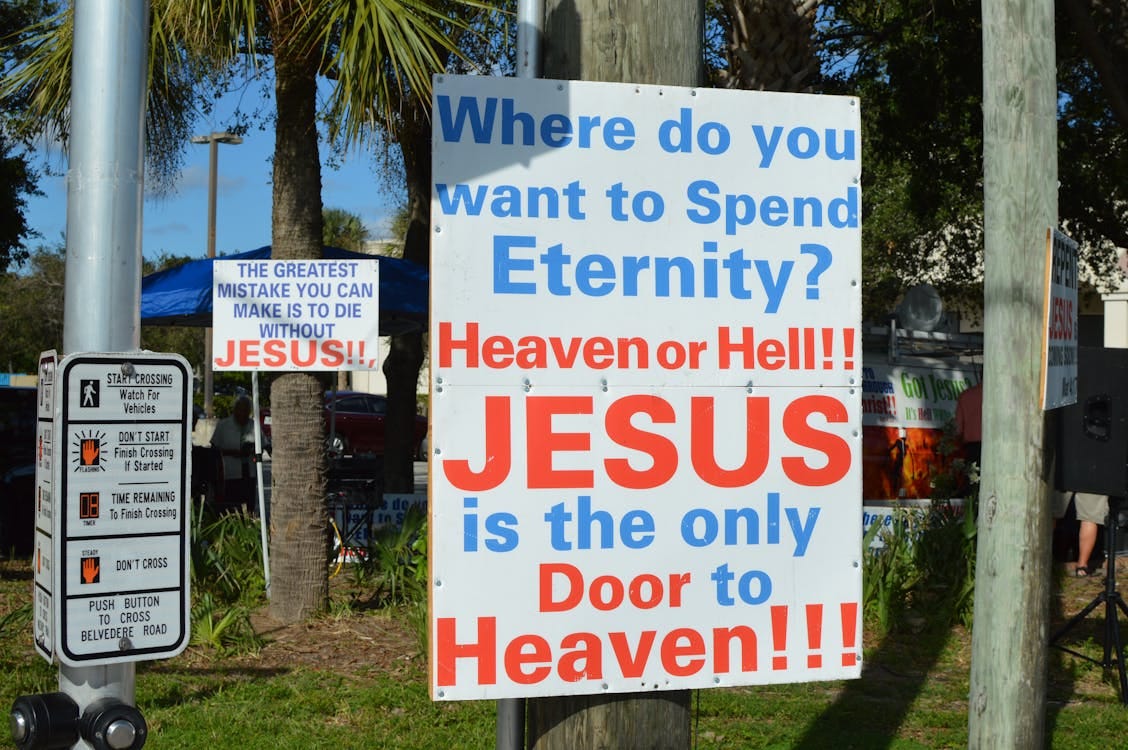 Free A bold outdoor sign displaying a Christian message about eternity and faith in Jesus. Stock Photo