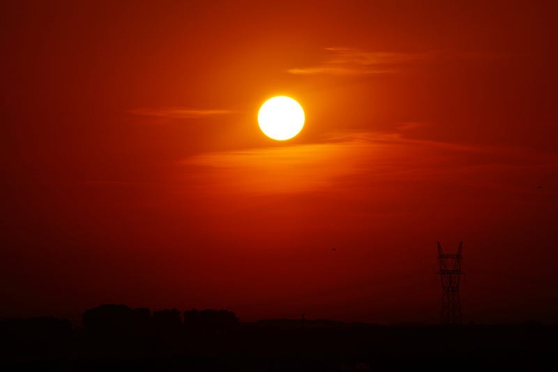 A red sunrise over a field