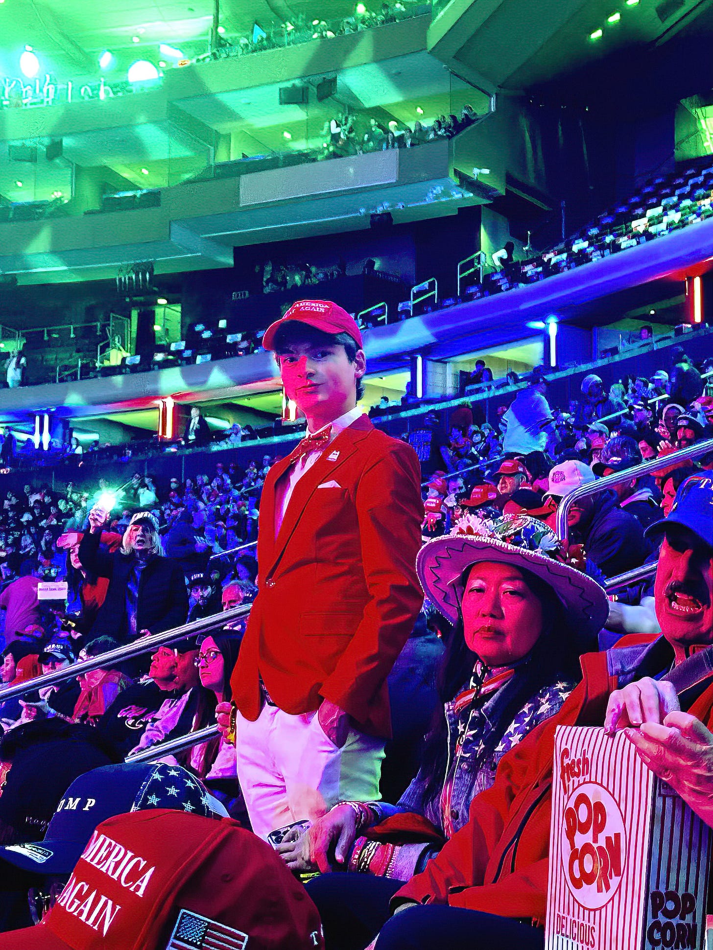 A young man in a bowtie awaits the arrival of Donald Trump at his Madison Square Garden political rally.