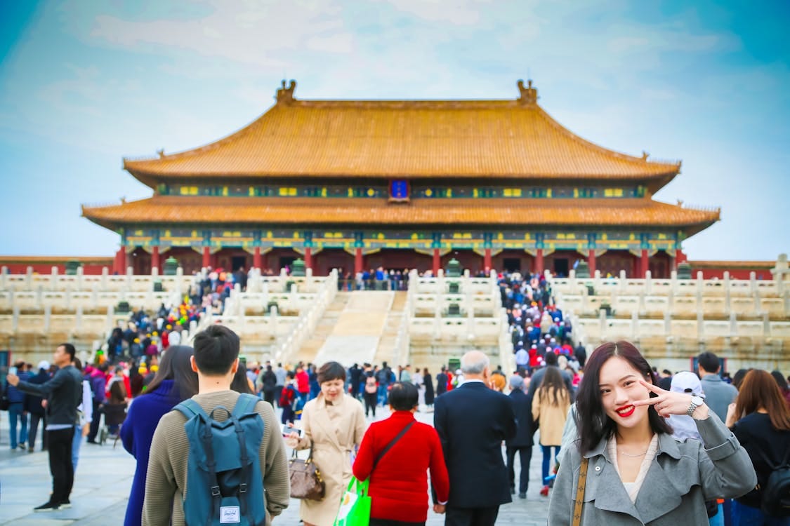 Free Tourists exploring the iconic Forbidden City in Beijing, a UNESCO World Heritage Site. Stock Photo