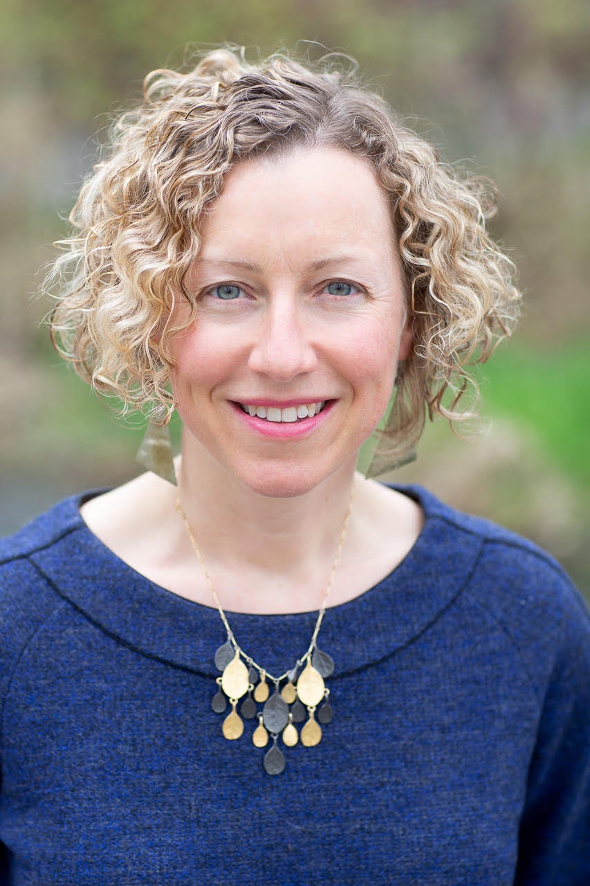 author photo Anna Farro Henderson; a white woman with curly blond hair smiles at the camera