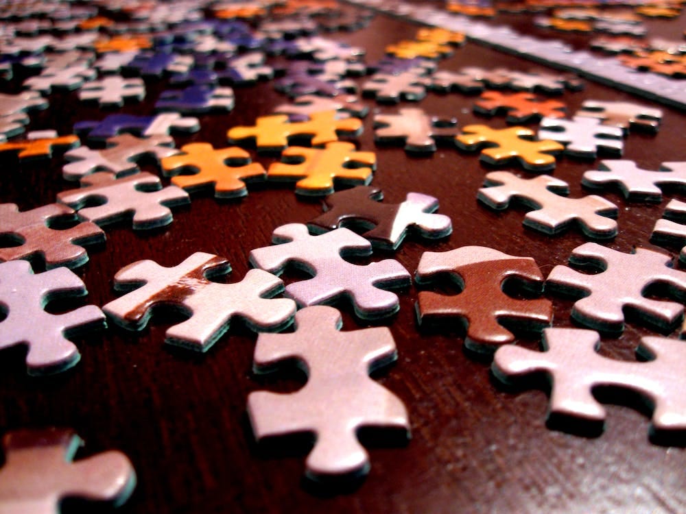 Free Selective Focus Photography of Assorted-color Puzzle Pieces Stock Photo