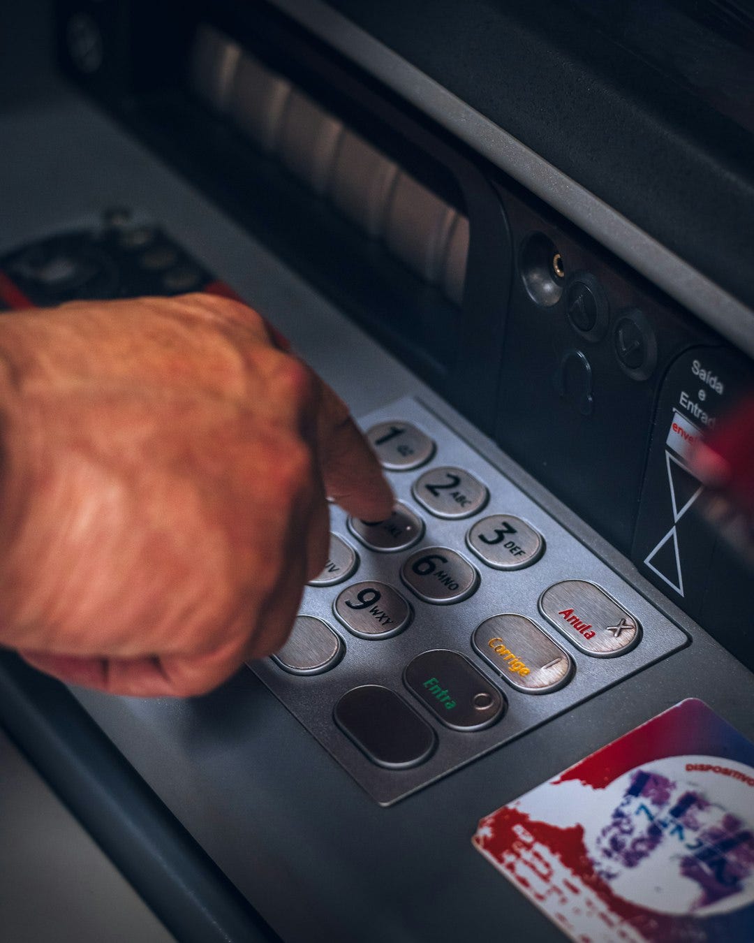 person holding gray and black control panel