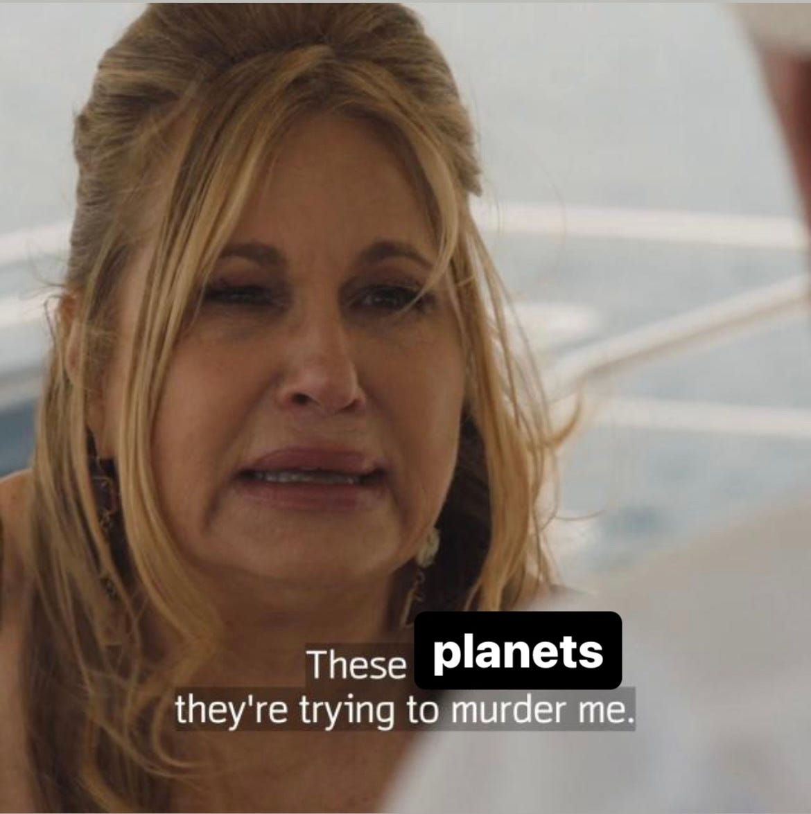 Jennifer Coolidge in The White Lotus screenshot, edited to read "These 'planets', they're trying to murder me."