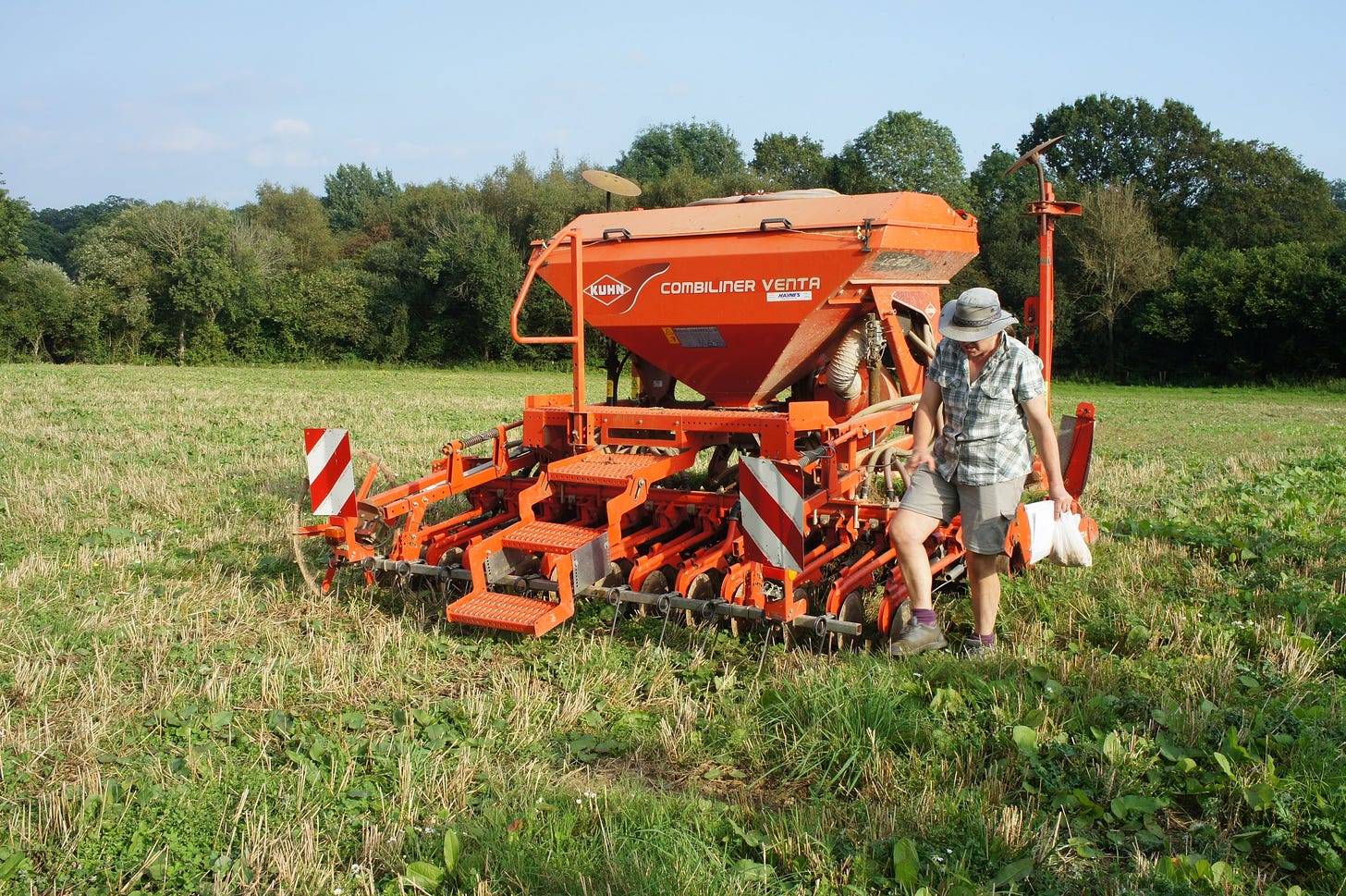 Brickpits organic farm East Sussex farmer Lynnie with harvester