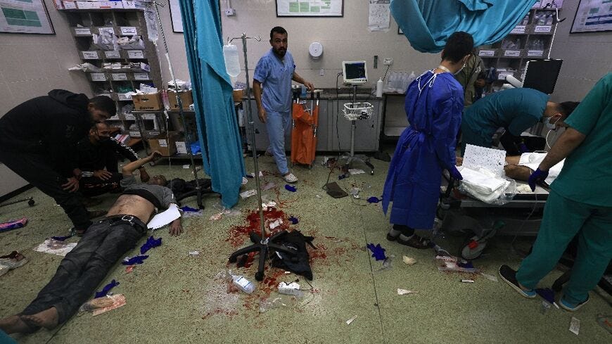 Medics tend to the wounded at the Nasser hospital in Khan Yunis
