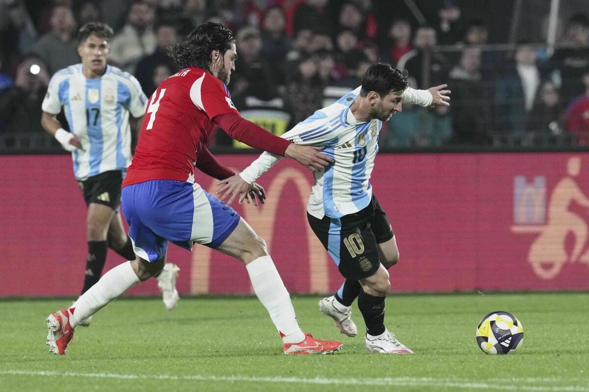 Argentina's Lionel Messi, right, and Chile's Francisco Sierralta 