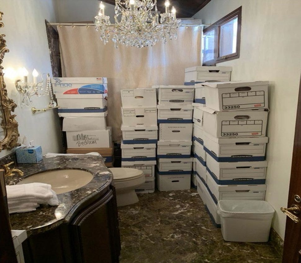 Photo of a bathroom at Mar-a-Lago, filled with stacks of boxes of classified documents. There's an unsecured window into the bathroom.
