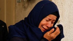 A Palestinian woman in Gaza mourns the death of loved ones in Israeli strikes on Rafah, on 10 February, 2024