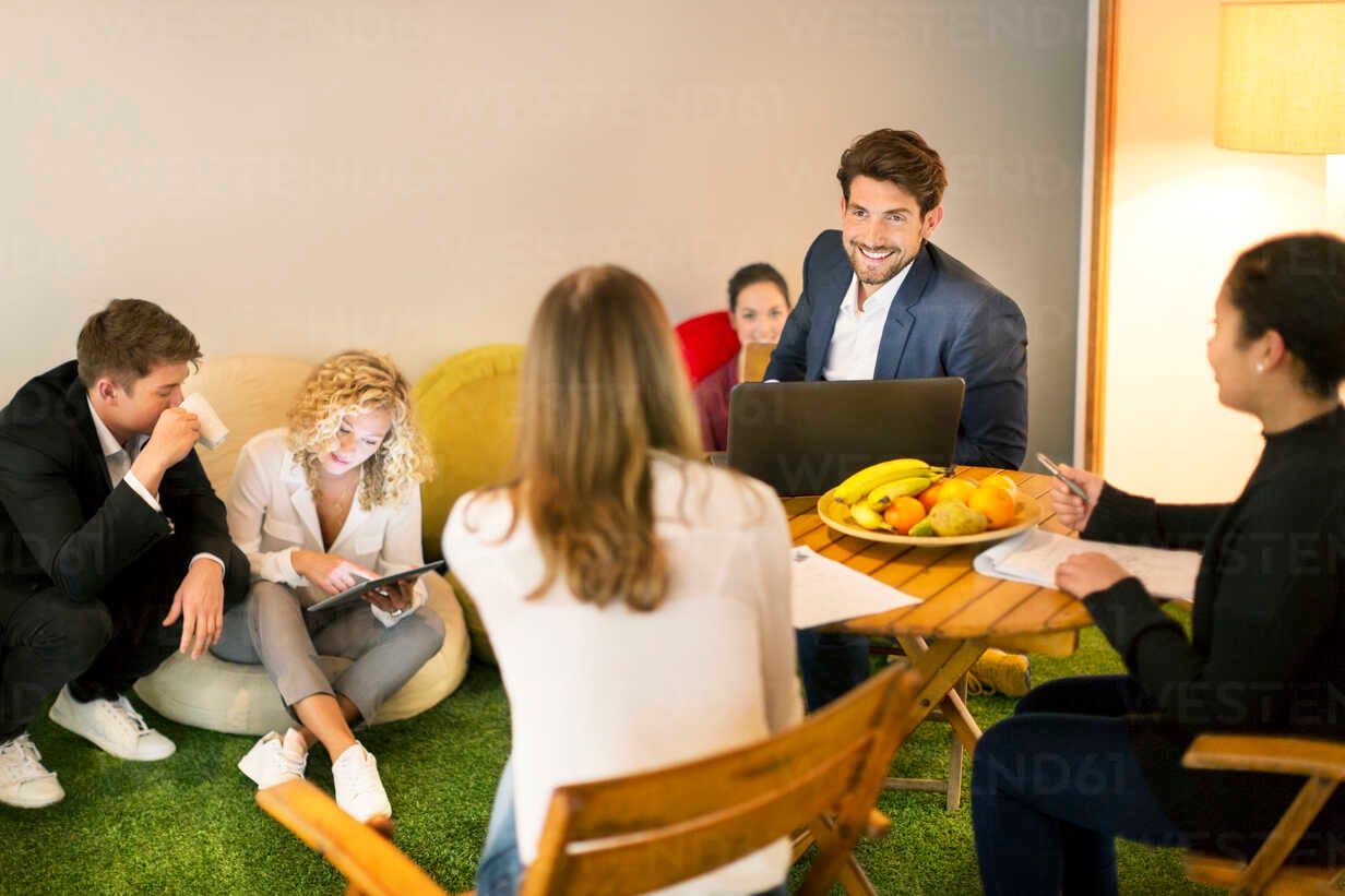 Business people working having a casual meeting in the office stock photo
