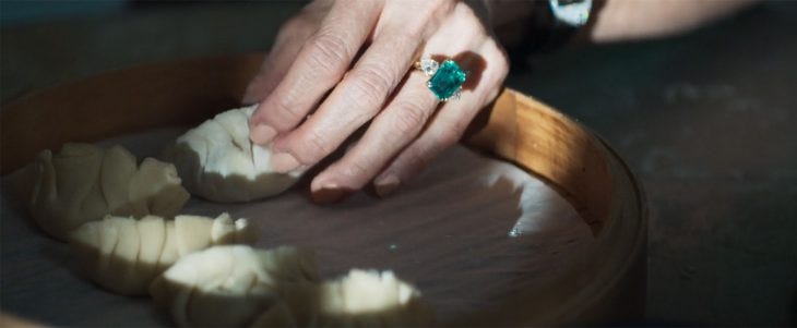 Dumplings and Eleanor's emerald and diamond ring in Crazy Rich Asians | Image credit: Warner Bros. Pictures