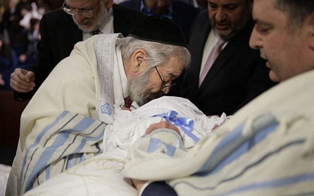 2015. (AP/Seth Wenig) NEW YORK (AP) — With a swift swipe of his scalpel, Rabbi A. Romi Cohn circumcises the baby boy, then leans down and sucks the blood