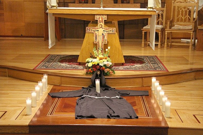 Secular Franciscans laid out a robe on the floor of Our Lady of Sorrows ...