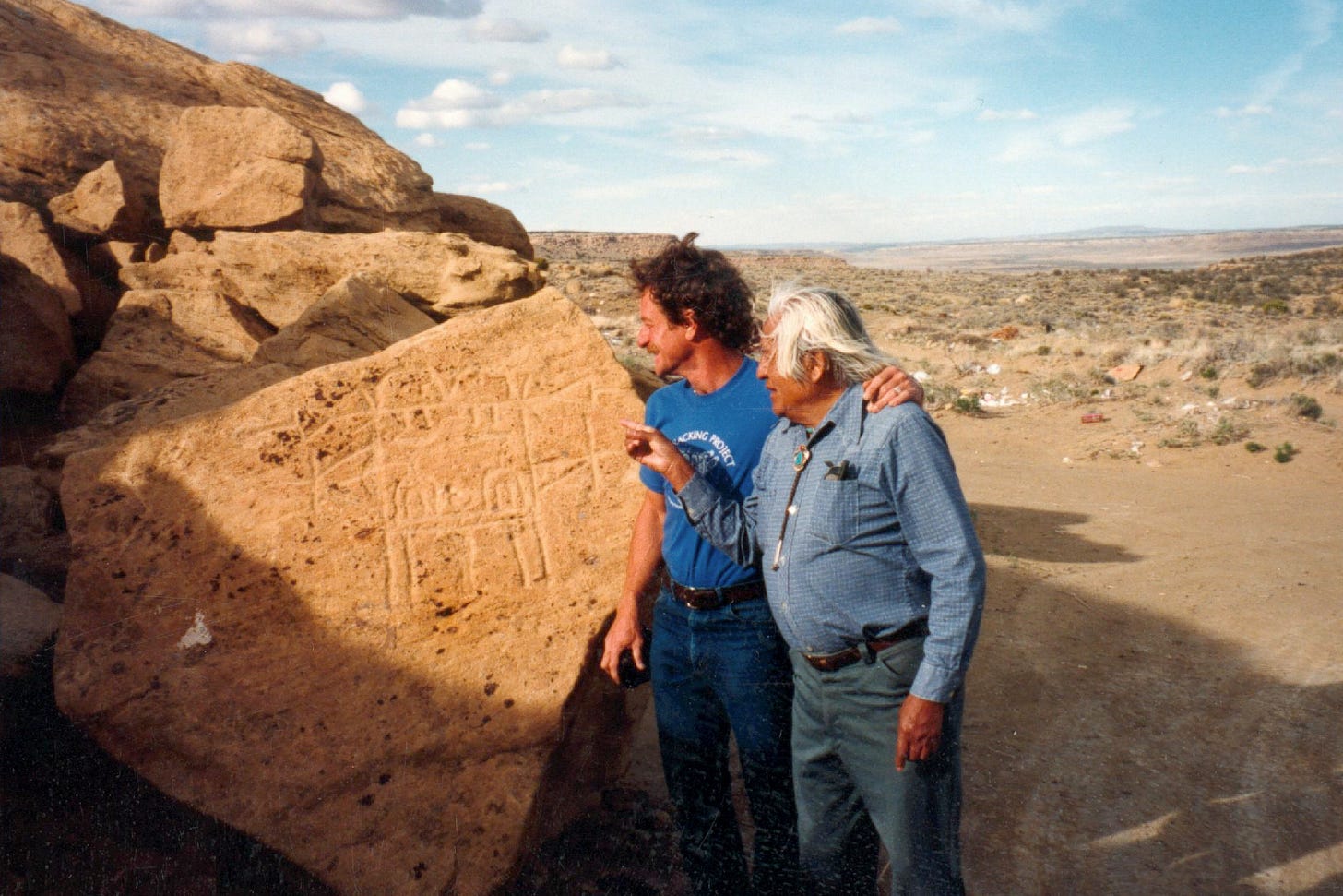 Artist and Educator, José Rey Toledo and John Stokes at Prophecy Rock near Oraibi, a Hopi village in northeastern Arizona, 1988.