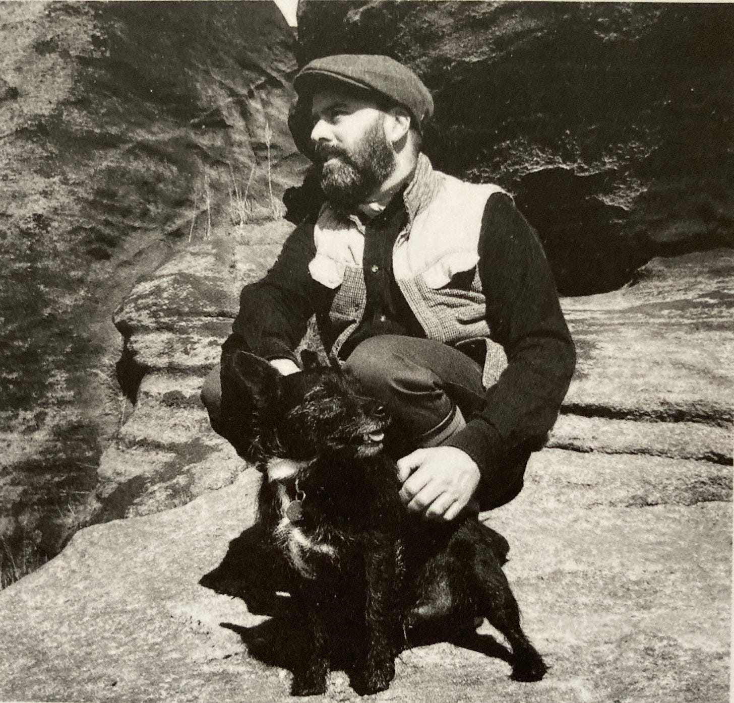 Author Benjamin Myers with his dog beneath Scout Rock from the book jacket of Under the Rock