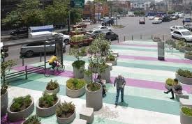 A street with a colorful striped walkway

Description automatically generated with medium confidence