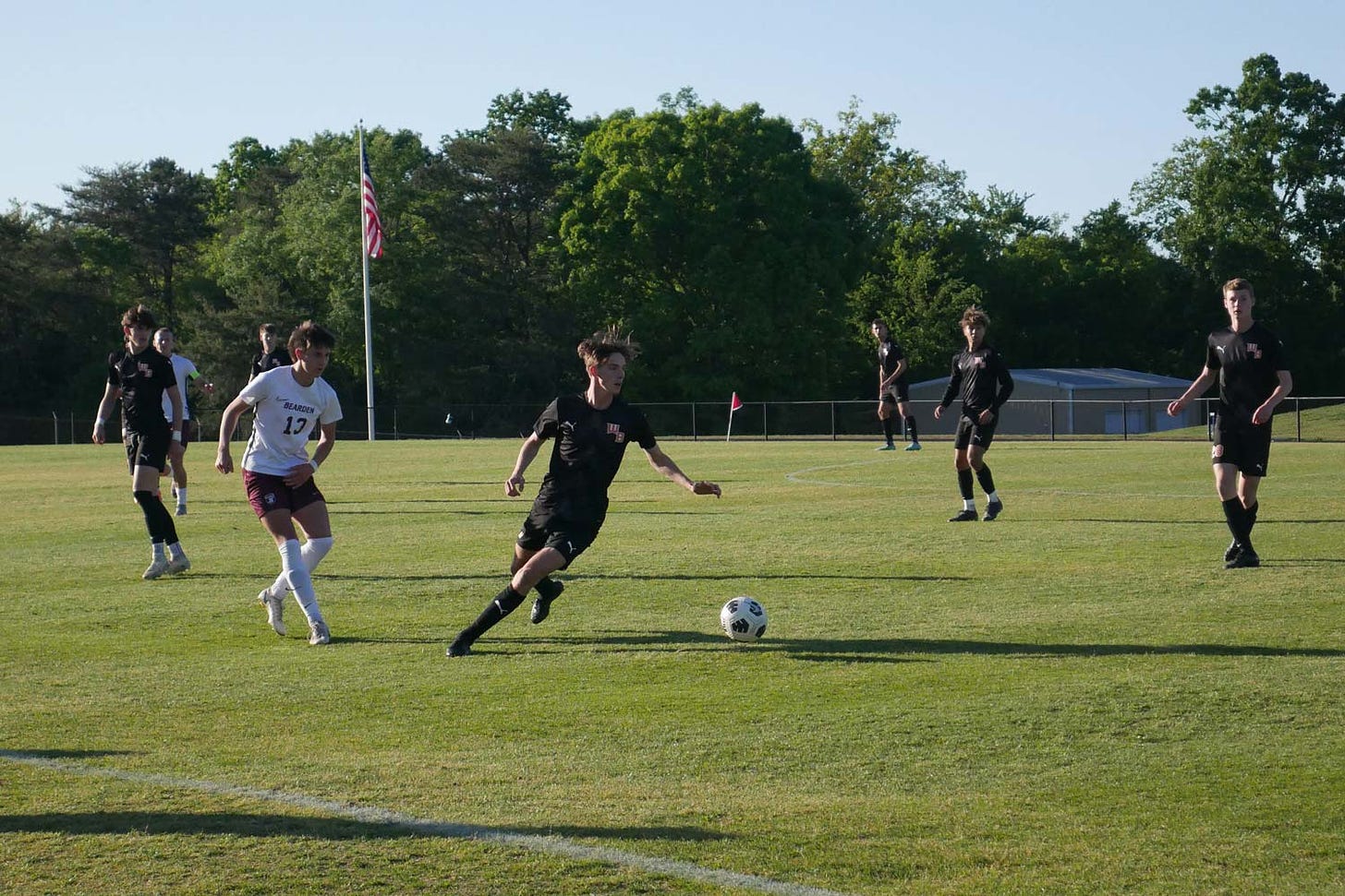 Bearden and William Blount boys soccer players compete on the field.