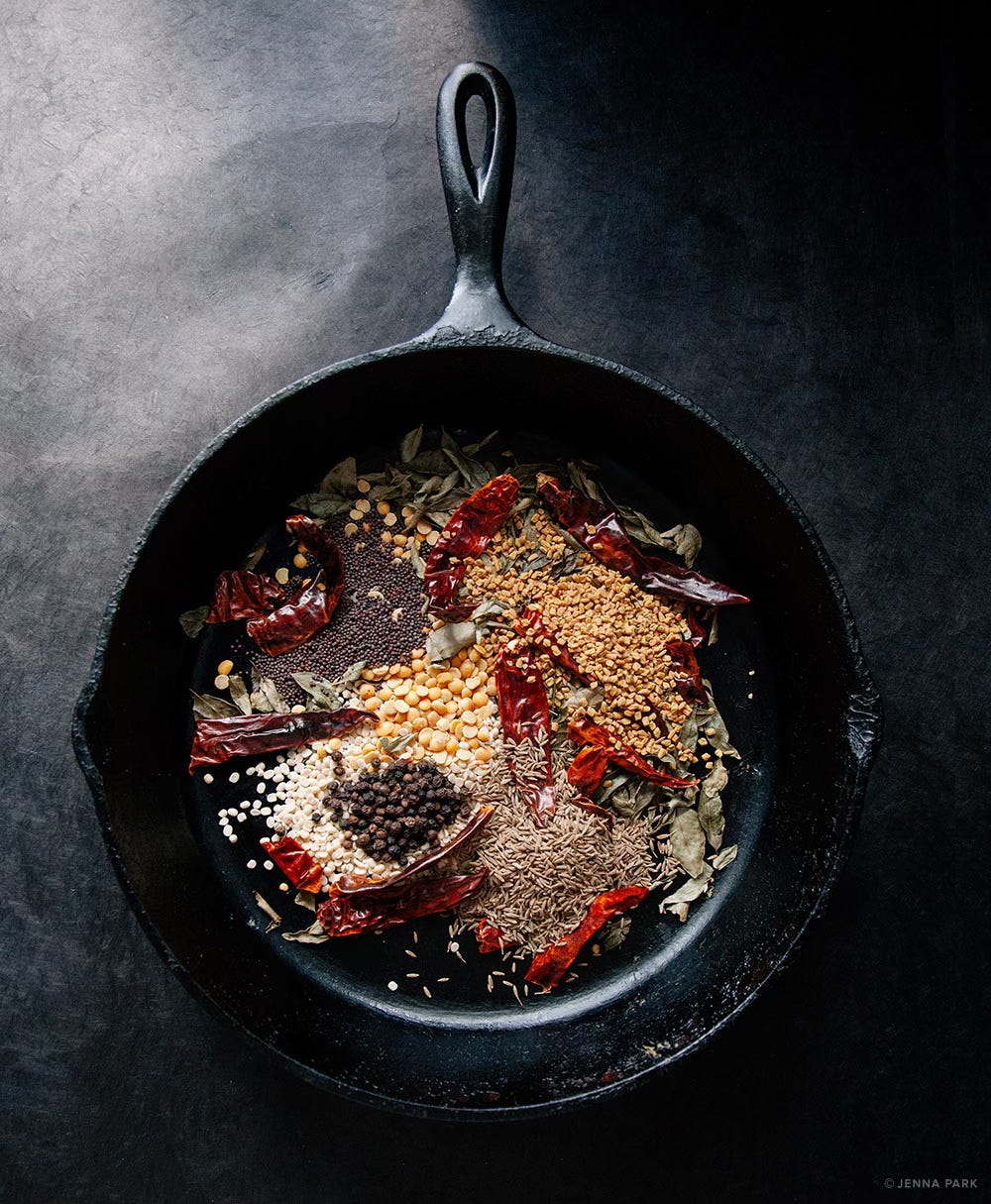 A pan roasting spices for curry