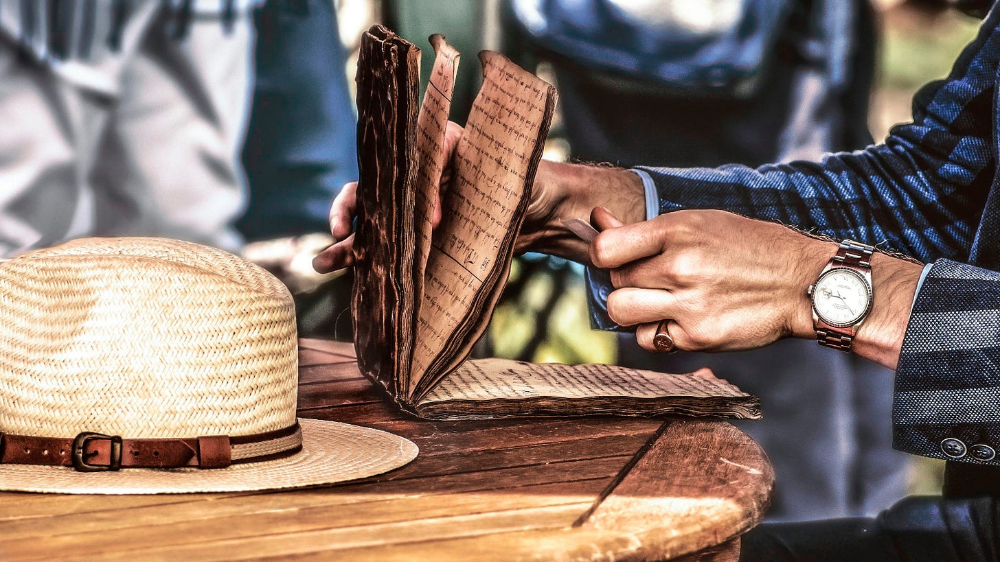 person holding opened book person holding opened book