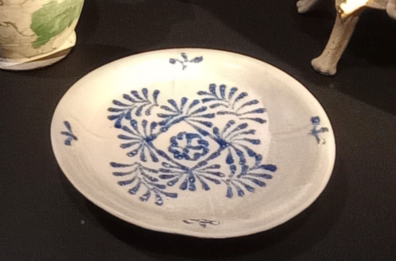 White plate with blue leaf patterns